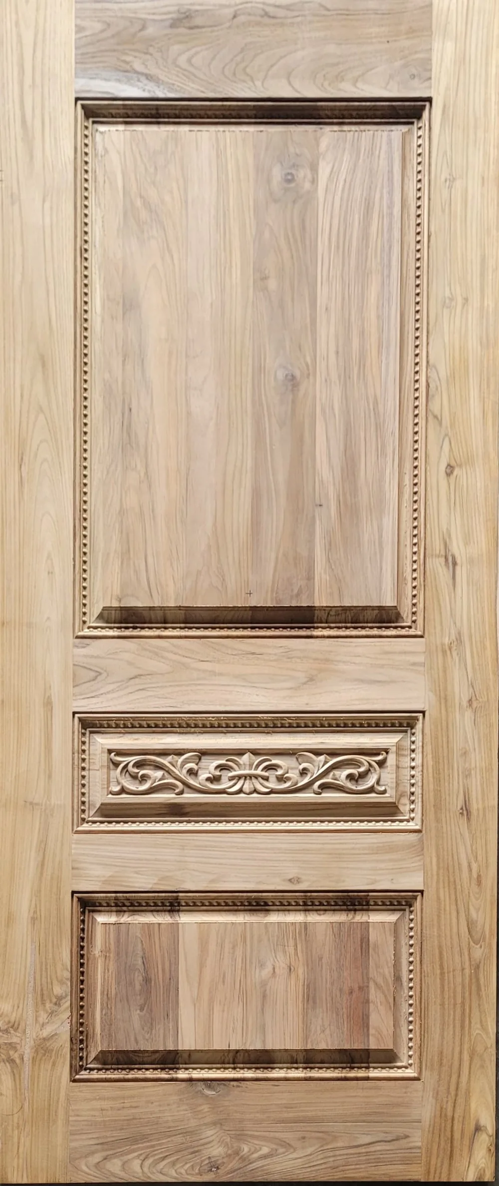 Three-panel teak door with carved floral centre