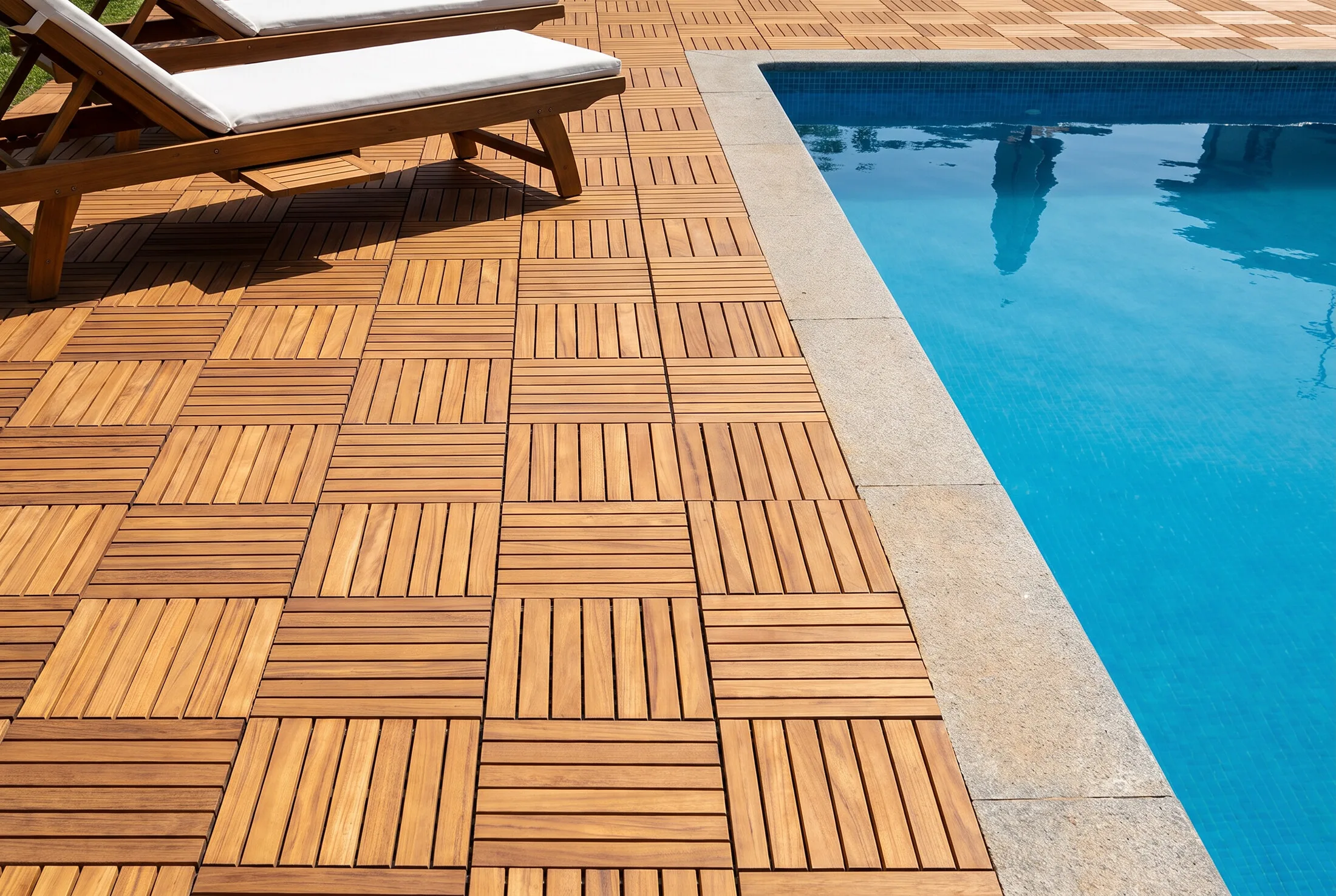 Wooden deck tiles running up to a pool edge