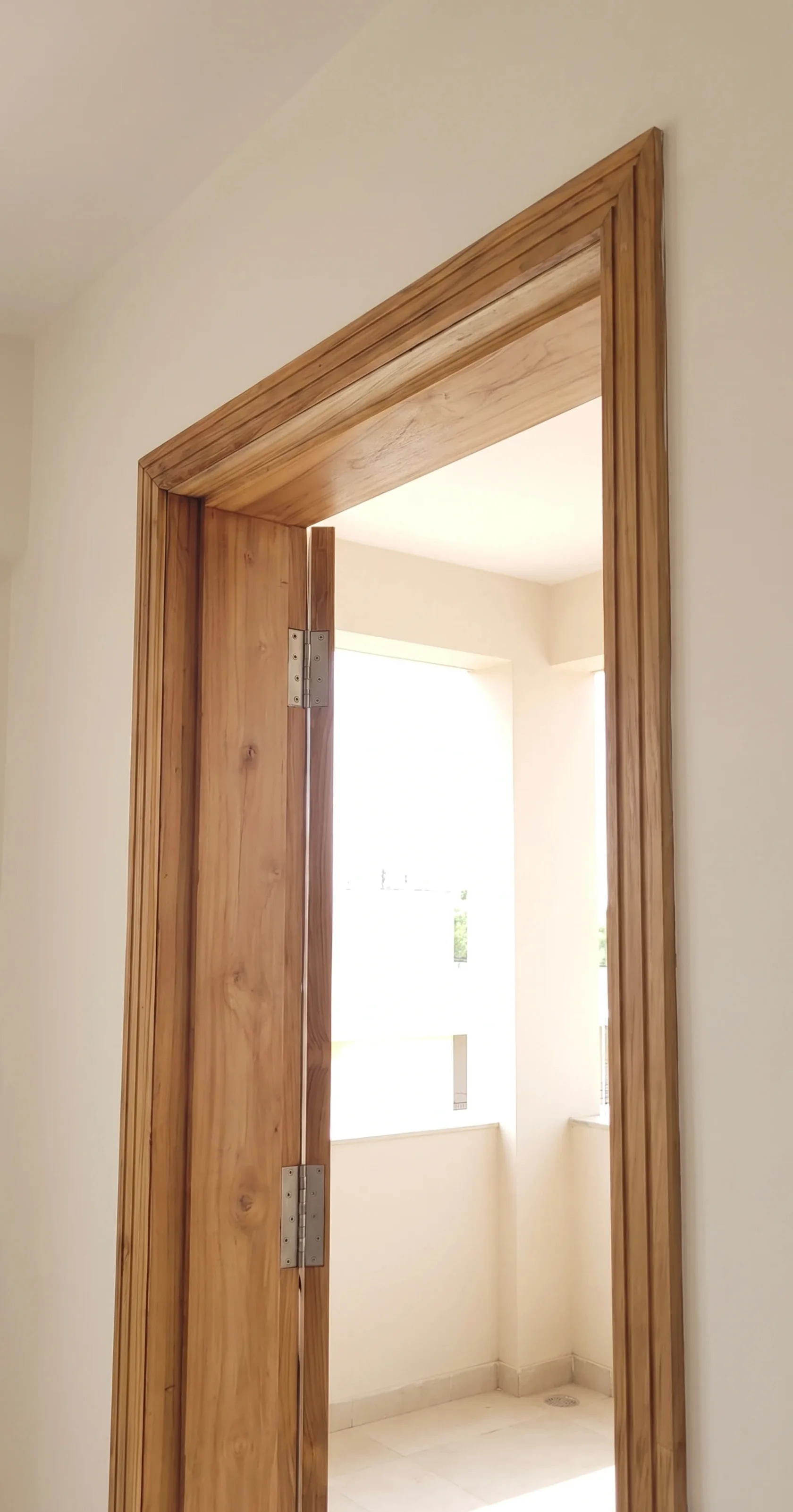 Solid teak door frame fitted in a home