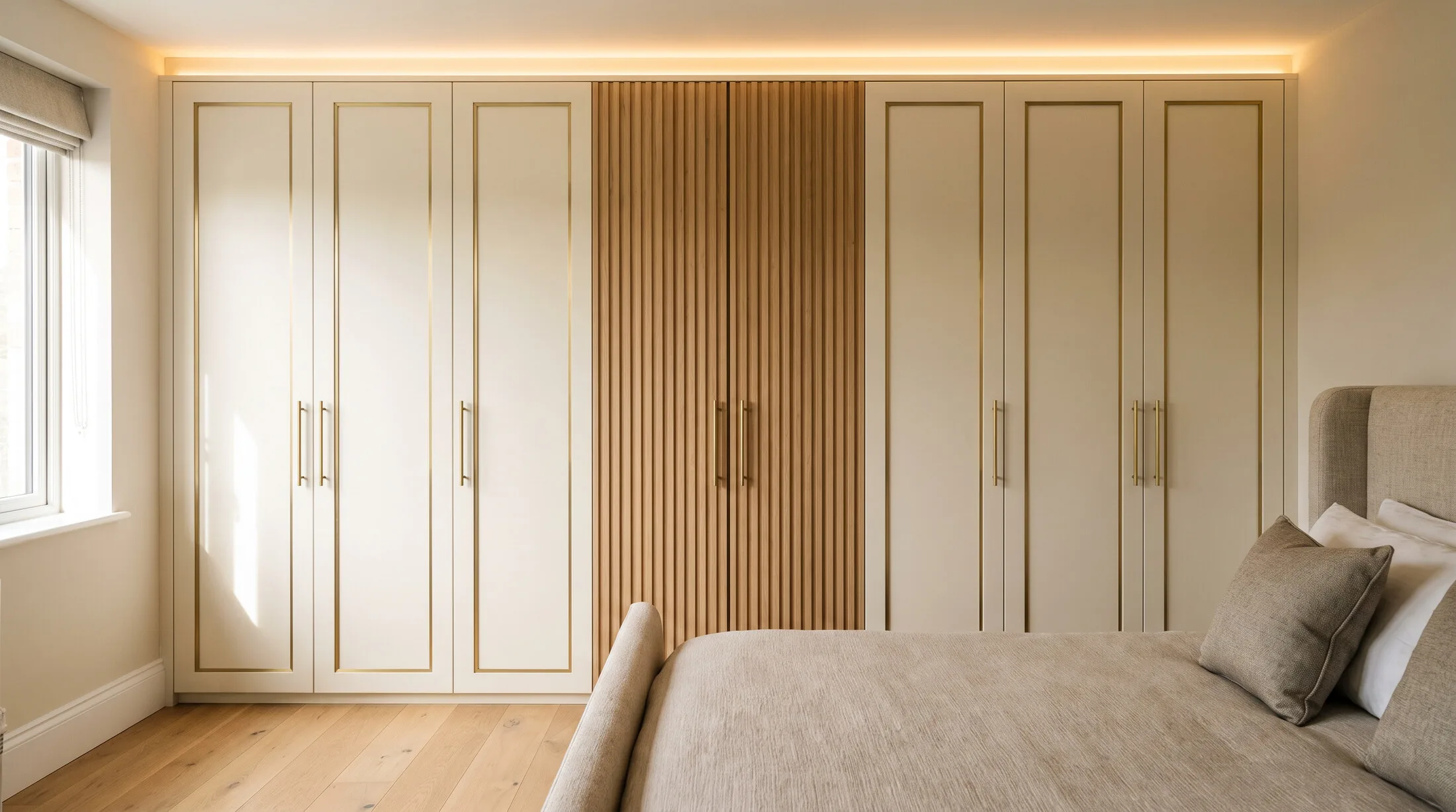 Modern cream fitted wardrobe with fluted wood